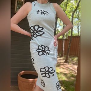 Light blue bodycon sweater dress with dark blue or teal flowers